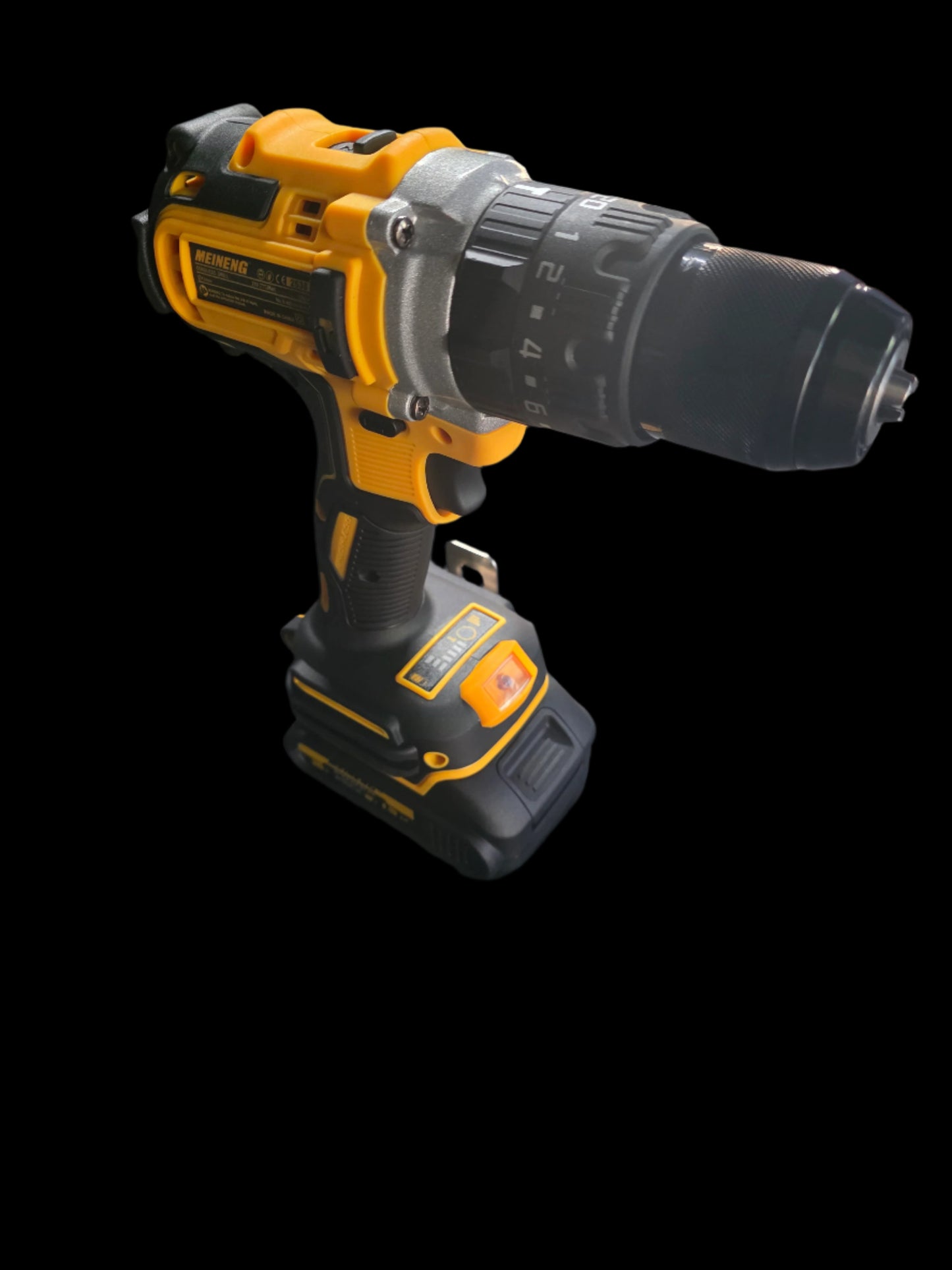 Yellow and black cordless drill on a dark surface