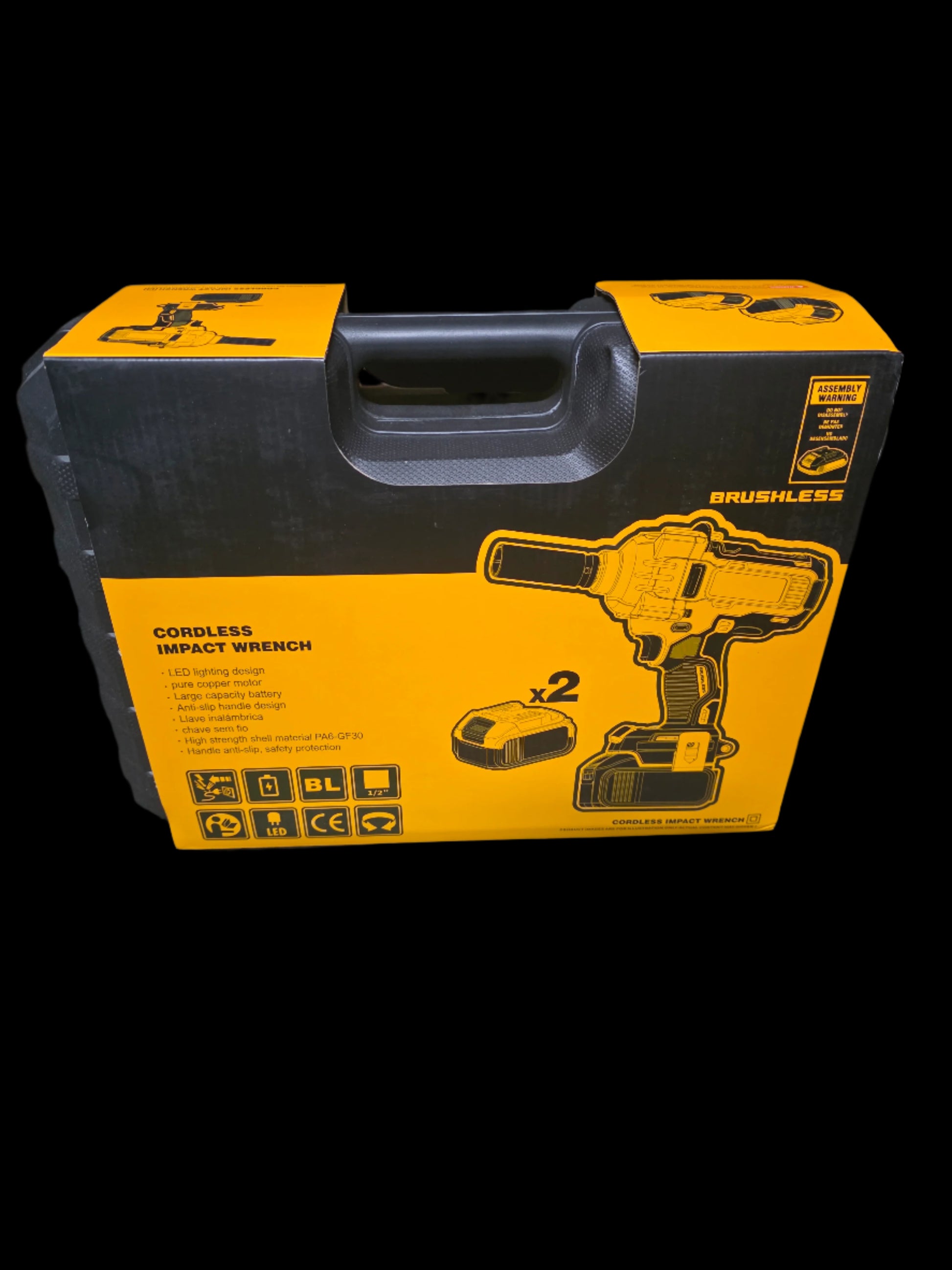 Yellow and black tool box with a cordless impact wrench on a dark surface